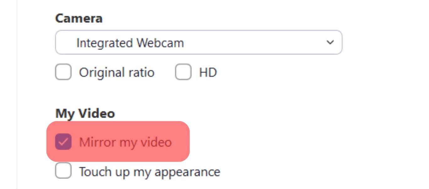 Uncheck The Mirror My Video Option.